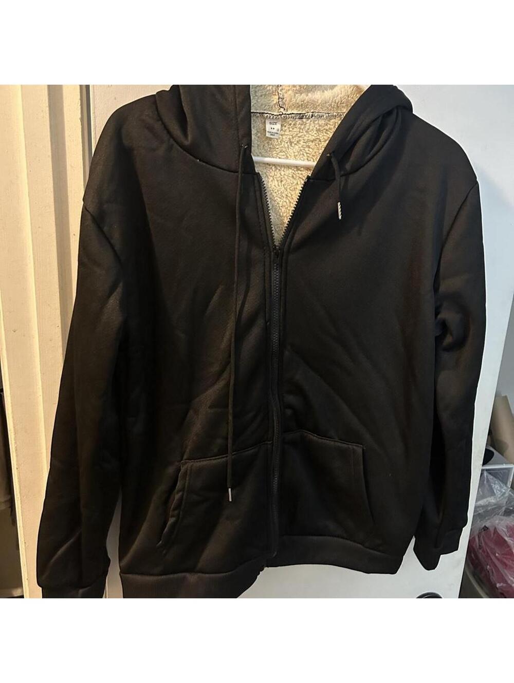 Brand new cozy Black Sherpa lined zip up hoodie in a women’s M